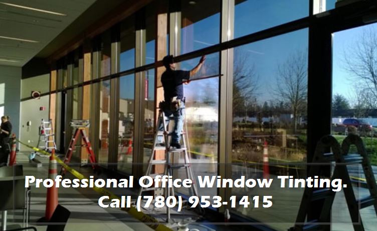 Guy tinting office windows